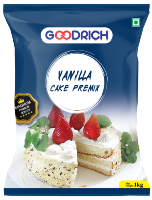 A bowl of rich vanilla cake batter made from Magnum premix, surrounded by fresh vanilla beans and a beautifully decorated vanilla cake topped with whipped cream and berries.