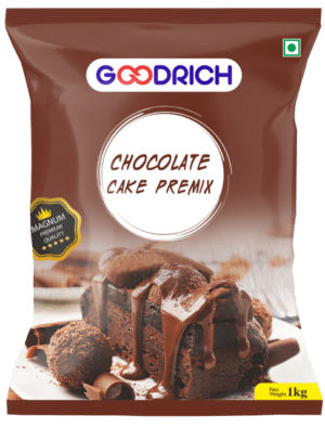 A bowl of luscious chocolate cake batter made from Magnum premix, surrounded by decadent chocolate cake slices topped with chocolate ganache and sprinkles.